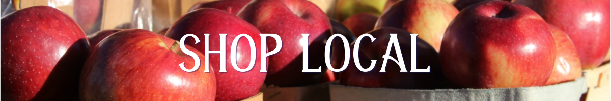 "Shop Local" with barrels of apples behind the text